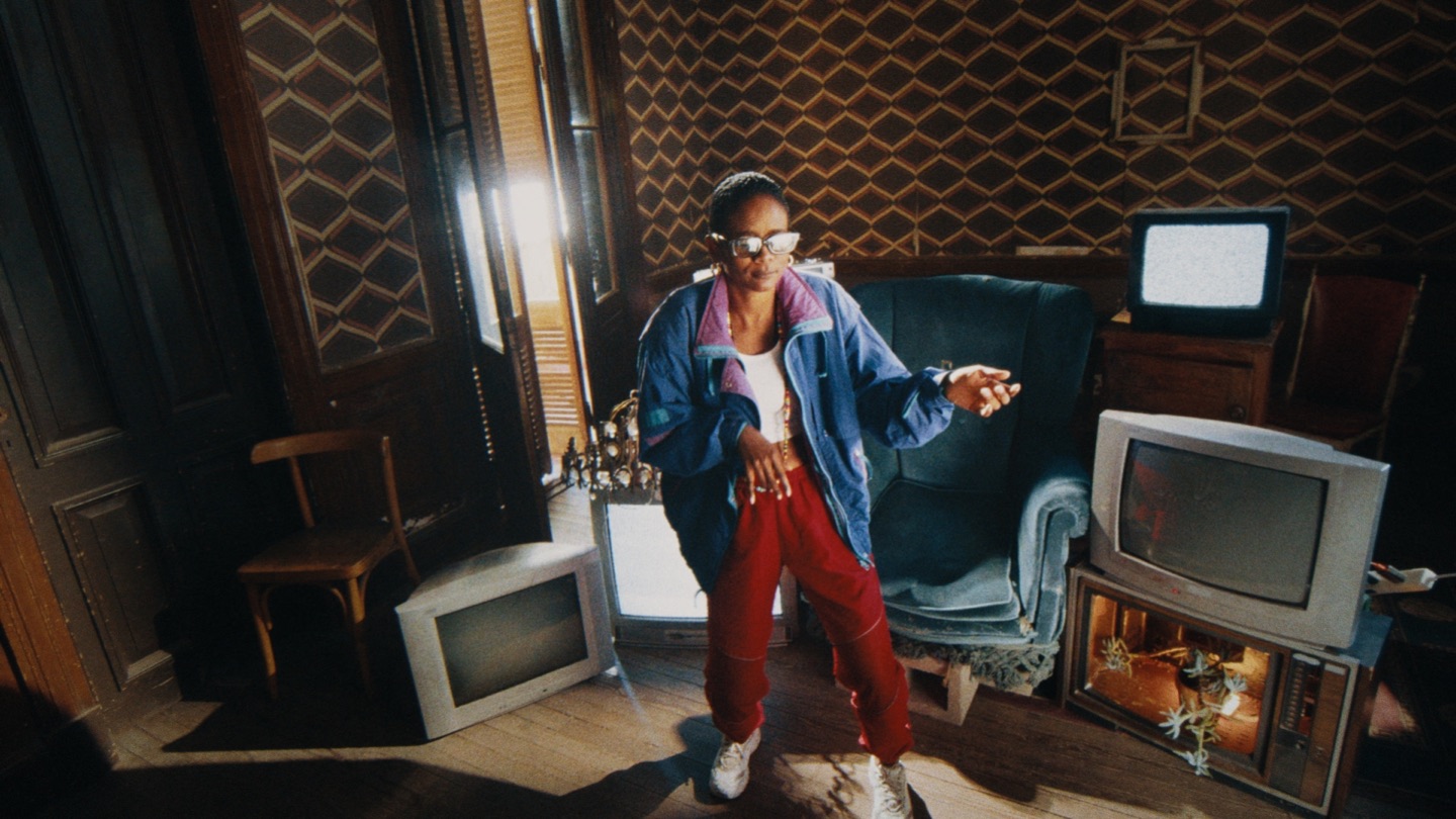 Wide portrait in a retro room with vintage televisions