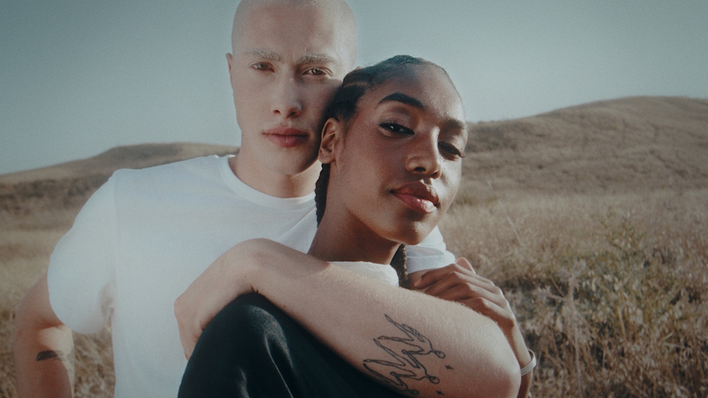 Two people in a field, graded with soft natural tones